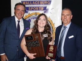 Emily Van Damme, the Wallaceburg Sports Hall of Fame's 2022 athlete of the year, centre, is shown with sportscaster Rod Black, left, and Chris Baertsoen, hall of fame organizing committee member. (Handout/Postmedia Network)