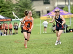 Hannah Davies (4) carries the ball during Saturday afternoon's season-opening Ontario Women's Field Lacrosse action at Kitchener-Waterloo for the Owen Sound(1) Krueger Custom Steel North Stars under-15 girls. Photo by Allison Davies