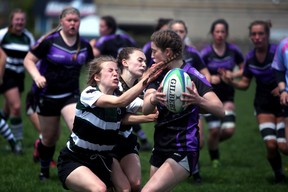 The Owen Sound District Wolves shut out the Grey Highlands Lions 35-0 Monday afternoon at OSDSS to win the Bluewater Athletic Association senior girls rugby championship and cap off another undefeated season. Greg Cowan/The Sun Times