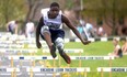St. Mary's Yuhai Mukenge clears a hurdle en route to winning the junior boys 100-metre hurdles prelim. Greg Cowan/The Sun Times