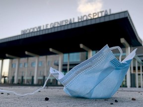Files: A facemask lies on the ground near the main entrance to Brockville General Hospital.