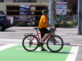 Rod Bilz waits for a green light while stopped in the bicycle box at Main Street and Memorial Drive.
PJ Wilson/The Nugget