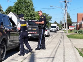 Lambton OPP officers are stationed out front of Lambton Central Collegiate and Vocational School on Thursday, June 2, 2022 in Petrolia, Ont. Terry Bridge/Sarnia Observer/Postmedia Network