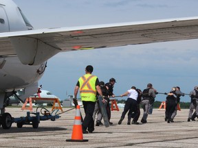 Members of the North Bay police might have had a bit of an advantage over other teams competing in the Pull for United Way airplane pull event, Friday. As soon as they got the 30,000-pound craft moving, members were jogging down the tarmac.
PJ Wilson/The Nugget