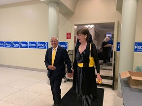 Nipissing-Conservative MPP-elect Victor Fedeli walks into the Davedi Club with his wife Patty Thursday night after winning the seat in Nipissing.