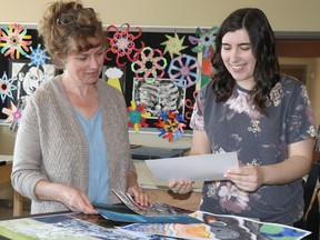 Genevieve DiCerbo and Samantha Lance prepare for art gala at St. Mary's College in Sault Ste. Marie, Ont., on Thursday, June 2, 2022. (BRIAN KELLY/THE SAULT STAR/POSTMEDIA NETWORK)
