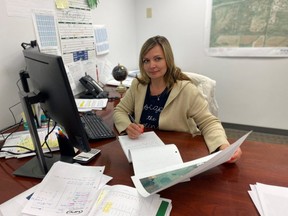 Mila Wagner, a single mother from Ukraine who left her home after the invasion of Crimea in 2014, sitting at work in Alberta thanks to the ASET program. Photo supplied