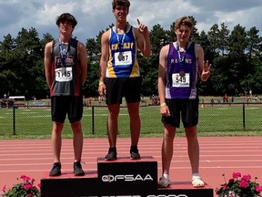 Pictured is Eastside Secondary SchoolÕs Aidan Crawford (right) receiving the schoolÕs first ever OFSAA medal. Crawford picked up a bronze in the novice boys javelin at the. Three other local athletes also collected medals at the championships held last week at York University, including:ÊRobert Lebourne Ñ Centennial, silver in 800 metre intellectual. Amelie Klauke Ñ Bayside, bronze in junior girls 300m hurdles and Ben Vreugdenhil Ñ Quinte Christian bronze in junior boys discus. Other local athletes competing included.: Greta Swartz Ñ Eastside was 4th in junior girls pole vault; Kevin Salaudeen Ñ Bayside 4th in junior boys triple jump; Trevor Brooks Ñ Quinte Christian 6th in novice boys discus; Nathan Vanderspruit Ñ Quinte Christian, 7th in novice boys discus; Amelie Klauke Ñ Bayside 7th in junior girls long jump; Lily Davidson Ñ Bayside 8th in junior girls long jump; Anna Phillips Ñ Centra; Hastings was 8th in senior girls Javelin; Abigail McAlpine Ñ Marc Garneau, 5th senior girls high jump; Ellen Davidson Ñ Centennial 4th girls 800 metre intellectual; Michelle George Ñ St. Paul, Trenton 5th 100 metre intellectual girls; Anden Smoke-Maracle Ñ Eastside 7th in ambulatory 100 metre.