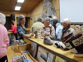 Dr. Sonja Ostertag talks to Huron Fringe Field Naturalists members Mary-Ann Knowles and May Kirkpatrick after her presentation at the club’s annual dinner meeting May 17.