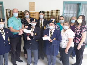 Members from the Royal Canadian Legion Branch 89 and Ladies’ Auxiliary recently presented donations to staff at Lady Minto Hospital and Villa Minto. Pictured here are, from left, front row: Dianne Denault, Dorothy Smith, Laura Toal, Noella Robin, and Jessica Lamarche; back row: Paul Chatelain, Jennifer Emond, Alain Sicard, Debby Mineault, Jessica Menard, and Cheryl Jolicoeur.