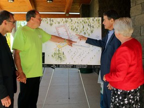 North Bay Mayor Al McDonald and Nipissing-Timiskaming MP Anthony Rota discuss the new multi-use facility planned for Steve Omischl Sports Fields while city engineer John Severino and Coun. Johanne Brousseau watch, Saturday.
PJ Wilson/The Nugget