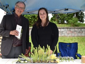 John Gunn, director of the Vale Living with Lakes Centre and Anastacia Chartrand, UN Decade of Restoration Science communications intern, are happy to distribute "gifts that grow" at the university’s Spring 2022 convocation.