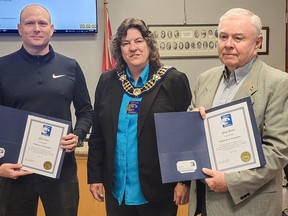 Mayor Janice Jackson, centre, presents the mayor’s award for excellence in volunteerism to Dave Fretz, left, and Gary Wood, right. Fretz and Wood accepted their certificates of recognition at the SBP council meeting on June 7.