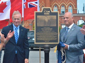City leaders gathered Wednesday across from City Hall to dedicate a plaque honouring Wolf Tausendfreund, second from left, a respected former 15-year city councillor from 1985 to 2000, well-known city barrister and Ontario Superior Court Justice appointed in 2006. From left were Elaine Tausendfreund, Mayor Mitch Panciuk and longtime friend and former mayor Ross McDougall. DEREK BALDWIN