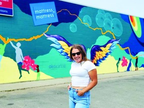 Leduc Arts Foundry Chair Breanne Debski shows off her mural in downtown Leduc. The Leduc Art Walk is set for July 16. (Michelle Schwengler)