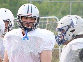 Sudbury Spartans running backs Brandon Salem, left, and Tanner Pattison chat during a practice at James Jerome Sports Complex in Sudbury, Ontario on Wednesday, June 15, 2022.