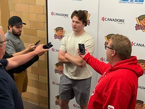 Justin Ertel talks to reporters after signing a standard player's agreement with the North Bay Battalion on Friday. The third-round pick in the 2019 Ontario Hockey League Priority Selection played last season with Cornell University.
