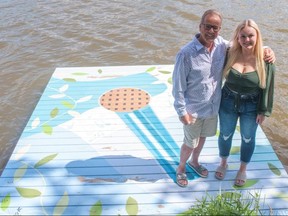 Hannah and Dale Thomas on their family’s dock, across the Avon River from Stratford’s Tom Patterson Theatre. The daughter-father duo will perform The Prayer on Sunday – Father’s Day – during the launch of pop singer Hannah’s third Dock Music Concert Series. (Chris Montanini/Stratford Beacon Herald)