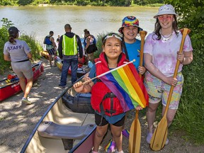 Sylken Smith, 10 of Six Nations gets ready to join friends Chiara Williamson and Emma Mutsaers (right) of Toronto for Paddle for Pride.