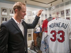Retired Canadian baseball player Justin Morneau checks out a display at the Canadian Baseball Hall of Fame and Museum in St. Mays. Morneau was inducted into the hall of fame June 18. Chris MontaniniStratford Beacon Herald