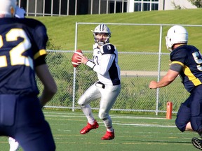 Sudbury Spartans quarterback Adam Rocha (17) prepares to make a pass against the Sault Steelers at James Jerome Sports Complex in Sudbury, Ontario on Saturday, June 18, 2022.