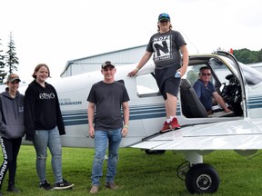 COPA Flight 177 offered free flights June 12 to children ages eight to 18, giving them the opportunity to experience flying, and possibly encourage future aviators. From left are Kortnie Humphrey, Natalia Fergusson, Kolson Humphrey, Tyler Fergusson and Chris Redfearn. Dan Rolph