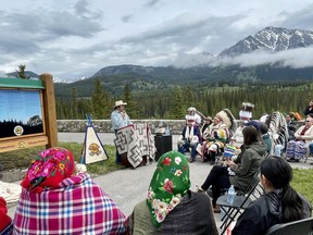 Representatives from both Siksika Nation and Parks Canada attend the official unveiling of the new signs at Castle Mountain on June 17th, 2022. In 2016, a settlement between the Government of Canada and Siksika Nation included $123 million-dollar compensation for illegal use of land granted in the late 1880s. Photo Marie Conboy/ Postmedia.