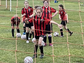 Cecilia Cistaro, of the Sault Junior United U10 girls program, gets her kicks in at a team practice at Strathclair Park on Sunday night.  Cistaro and her teammates are competing in the Robbie Festival this weekend in Toronto. SUPPLIED