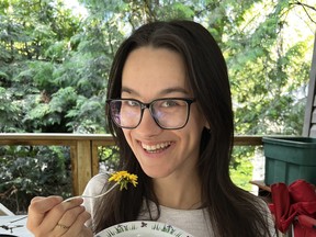 Macy Rodriguez of Sudbury eating a bowl of fresh dandelion flowerheads. Joe Shorthouse photo