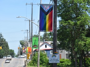 A Progress Pride banner hangs outside a Home Hardware on Stover Street in Norwich, a rural community east of London. A small sign mounted to the pole includes a Bible reference that reads: "The Rainbow God’s Promise. Genesis 9 v 16." The banner is one of two that were reinstalled after several were stolen last month. Calvi Leon/The London Free Press