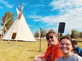 Students from Bev Facey pose in front of the new land-based learning tipis. Photo supplied