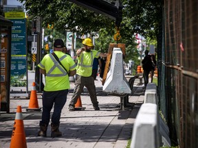 Crews were working at setting up cement barriers along Wellington Street, near the Supreme Court.