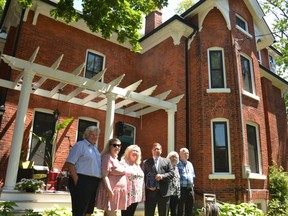 The Stratford home of the Hon. Dr. James Palmer Rankin at 198 Church Street where the MP, senator, doctor and First World War veteran lived from 1920-1934 was honoured  with a Stratford Blue Plaque Award from Heritage Stratford Tuesday afternoon. Pictured from left are homeowners Richard Nesbitt, Olivia Nesbitt and Lucy Lawlor, current Perth-Wellington MP John Nater, and two of Rankin's great grandchildren, Adrian Hey and Gordon McTaggart. (Galen Simmons/The Beacon Herald)