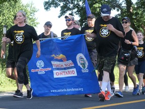 The lead runners in the 2022 Law Enforcement Torch Run in Simcoe last Thursday started the 'walk and run' at a brisk pace. CHRIS ABBOTT
