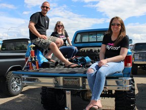 People sit in the back of a 1984 Chevrolet Silverado after it won "Most Fort Mackiest Truck Award" at Fort City Church's father's day car show in Fort McMurray, Alta. on Sunday, June 19, 2022. Vincent McDermott/Fort McMurray Today/Postmedia Network