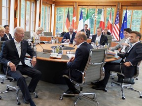 Britain's Prime Minister Boris Johnson, Japan's Prime Minister Fumio Kishida, U.S. President Joe Biden, Germany's Chancellor Olaf Scholz, European Commission President Ursula von der Leyen, France's President Emmanuel Macron, Canadian Prime Minister Justin Trudeau and Italy's Prime Minister Mario Draghi attend a meeting alongside the G7 leaders summit at Bavaria's Schloss Elmau, near Garmisch-Partenkirchen, Germany June 28, 2022. Stefan Rousseau/Pool via REUTERS