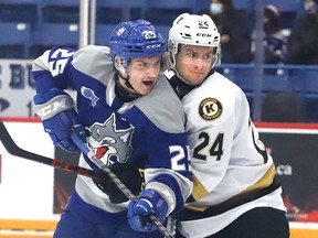 Dominik Jendek, left, of the Sudbury Wolves, and Thomas Budnick, of the Kingston Frontenacs, battle for position during OHL action at Sudbury Community Arena in Sudbury, Ontario on Friday March 4, 2022. Jendek was Sudbury's only import player in 2021-22.