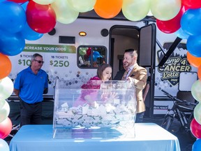 Carl Cox RV Sales Manager Catherine Cox-Semenuk pulls out the winning ticket on Thursday for 2022's Camp4Cancer Lotto fundraiser supporting improved oncology services at QHC Belleville General Hospital. ALEX FILIPE