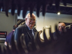 Quinte West Mayor Jim Harrison is seen through the jaws of a Tyrannosaurus Rex skull during the grand opening of the Quinte Museum of Natural History in Trenton, Ontario on Thursday. ALEX FILIPE