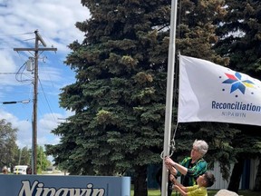 Mayor Rennie Harper raised the Reconciliation Nipawin flag over town hall on Tuesday, June 21 in honour of Indigenous People's Day. Photo supplied / Denise Blomquist