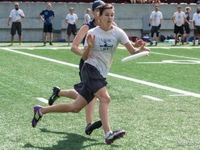 Kingston's Katie Fizzell, who will be competing at the World Masters Ultimate Club Championships in Ireland, catches a Frisbee as a defender comes up behind her. Sumbitted photo