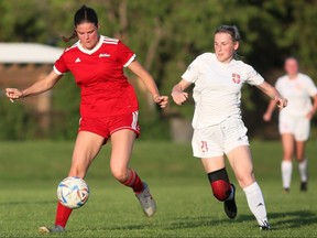 Chatham Strikers' Sophie Maine, left, battles Kaitlyn Manicom of the London Serbian Club during a London & Area Women's Soccer League game at St. Clair College's Chatham Campus in Chatham, Ont., on Tuesday, June 21, 2022. Mark Malone/Chatham Daily News/Postmedia Network