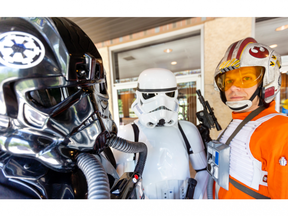 A trio of Star Wars cosplay fans - Tie Fighter pilot Paul Van Dyk, stormtrooper Brendan May and X-Wing pilot Andrew Smith - pose at Centennial Hall, where the Forest City ComiCon is being held June 25. Mike Hensen/The London Free Press