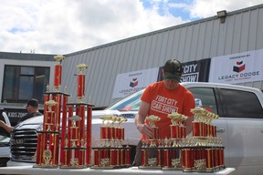 A volunteer prepares trophies at Fort City Church’s father’s day car show in Fort McMurray, Alta. on Sunday, June 19, 2022. Vincent McDermott/Fort McMurray Today/Postmedia Network