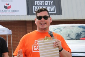 Pastor Lucas Welsh at Fort City Church’s father’s day car show in Fort McMurray, Alta. on Sunday, June 19, 2022. Vincent McDermott/Fort McMurray Today/Postmedia Network