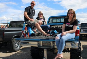 People sit in the back of a 1984 Chevrolet Silverado after it won “Most Fort Mackiest Truck Award” at Fort City Church’s father’s day car show in Fort McMurray, Alta. on Sunday, June 19, 2022. Vincent McDermott/Fort McMurray Today/Postmedia Network