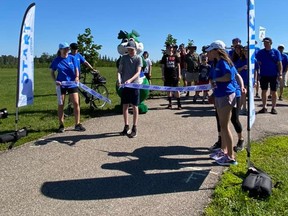 Supporters cut the ribbon at the annual Fort Saskatchewan walk to end type one diabetes. Photo supplied.