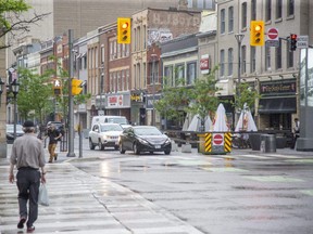 A traffic-signal pilot project aims to boost pedestrian safety by giving them a five-second headstart to cross the road at Dundas and Wellington streets before the light turns green for vehicles, a city official says.  (Derek Ruttan/The London Free Press)