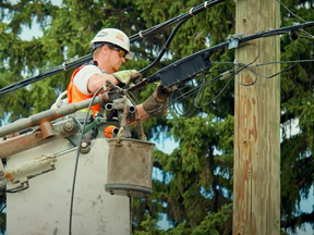 A man connects a home to Telus' PureFibre network in a screenshot from a video on what to expect during construction that was posted to the company's YouTube account.
