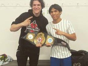 Zach Contos (left) and Jim Pacibe take a celebratory photo following their winning bouts at Alberta Diamond Belt in Lacombe. Photo courtesy of Humble Boxing Academy